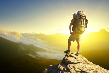 Wall Mural - tourist on mountain peak. active life concept..