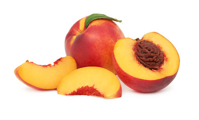 Wall Mural - One whole and sliced nectarine with green leaf (isolated)