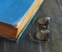 Retro Glasses And Old Book