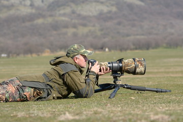 Wall Mural - wildlife photographer outdoor in action