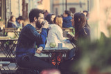 Fototapeta  - Hipster couple drinking coffee in Stockholm old town.