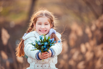 little girl with a snowdrops