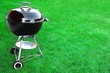 BBQ Charcoal Grill Appliance On The Lawn Background With Copy Sp