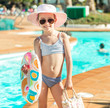 little cute girl near the pool 