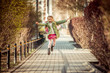 happy little girl running  from school