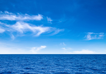 Wall Mural - white fluffy clouds with rainbow in the blue sky