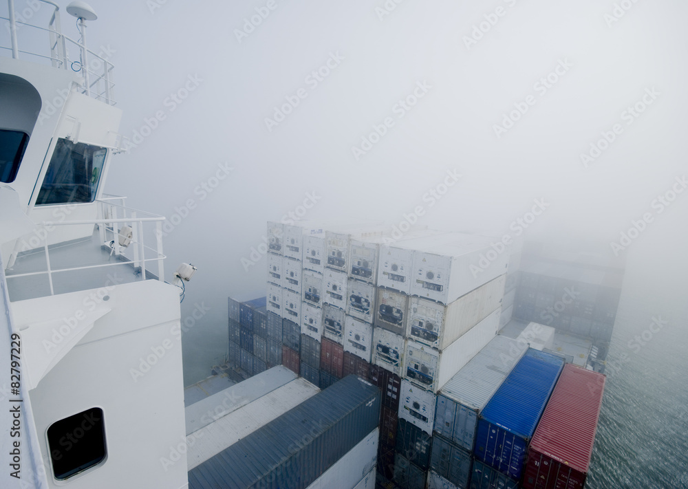 cargo ship navigating through misty English Channel Stock Photo | Adobe ...
