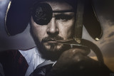 pirate with hat and eye patch holding a sword