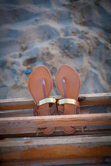 Beach slippers on sand