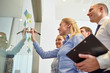 © Syda Productions - smiling business people with marker and stickers