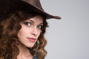 Wall Mural - Young lady in a cowboy hat