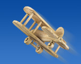 Wooden plane in the blue sky
