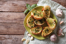 Bread With Garlic And Herbs On Plate. Top View Horizontal
