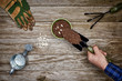© goodmanphoto - a gardener adding soil to a pot with seeds