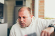 © ysbrandcosijn - Thoughtful balding middle-aged man