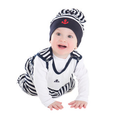 funny baby boy toddler in sailor clothes crawling isolated on wh