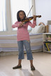 © Bruce Laurance/Blend Images - African American girl playing violin