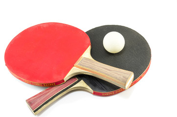 Two table tennis rackets and a ball isolated