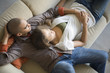 © Klaus Tiedge/Blend Images - African American couple laying on sofa