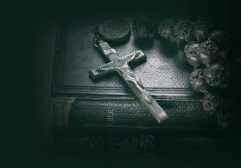 Cross crucifix on a bible