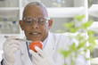 © Klaus Tiedge/Blend Images - African scientist performing analysis in laboratory on tomato