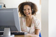© Klaus Tiedge/Blend Images - African businesswoman wearing headset