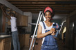 © Tanya Constantine/Blend Images - African American couple remodeling house
