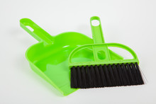 Garbage Scoop And Broom On White Paper Background