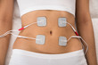 Woman With Electrodes On Her Stomach