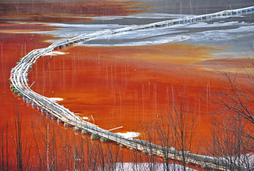  Pollution of a lake with contaminated water from a gold mine.