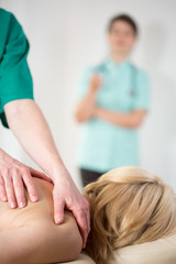 Wall Mural - Doctor observing masseur