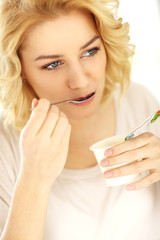 Poster - Woman eating yogurt