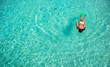 © travnikovstudio - Young woman snorkeling in tropical water on vacation