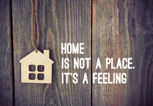 House As Symbol On Wooden Background With Quote