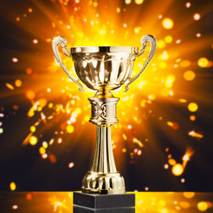Wall Mural - gold cup trophy against shiny sparks background