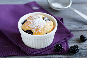 Wall Mural - Cupcake with berries and icing sugar