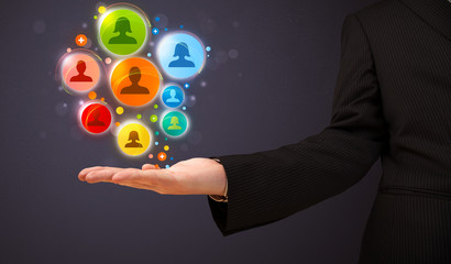 Wall Mural - Social network icons in the hand of a businessman