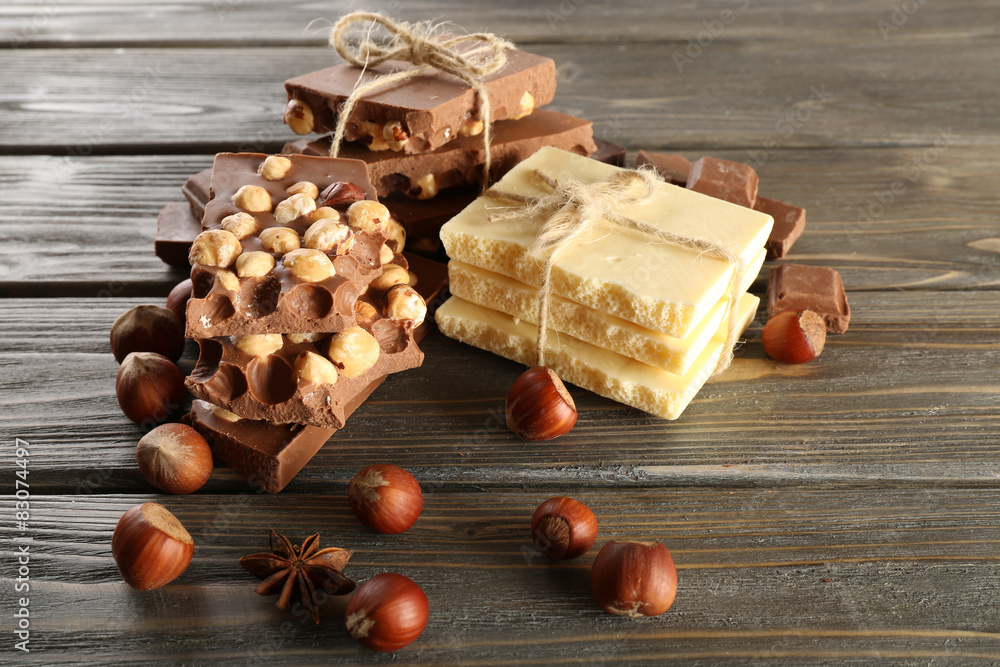 Set of chocolate with hazelnut on wooden background
