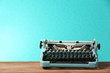 © Africa Studio - Old retro typewriter on table on green background