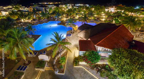 Fototapeta na wymiar View on hotel and swimming pool at night