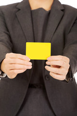 Wall Mural - Businesswoman holding blank card.