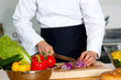 © stockyimages - Chef chopping vegetables