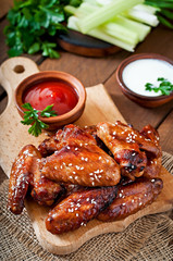 Wall Mural - Baked chicken wings with teriyaki sauce