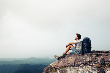 hiker relaxing on the rock