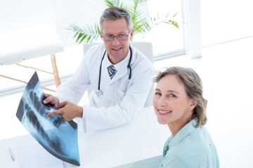 Wall Mural - Doctor showing xray to his patient