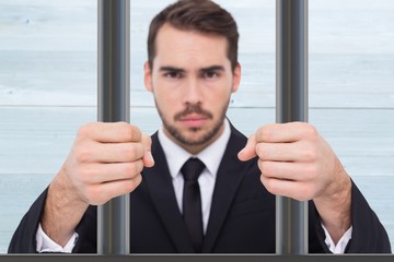 Poster - Composite image of exasperated businessman with clenched fists 