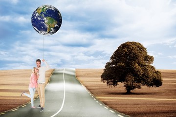 Poster - Composite image of attractive couple smiling and cheering