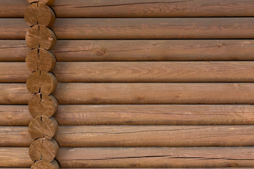 timbered wooden wall made from logs as background