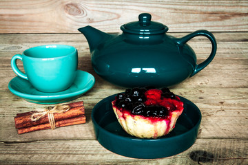 set of colorful cups and dishes and dessert