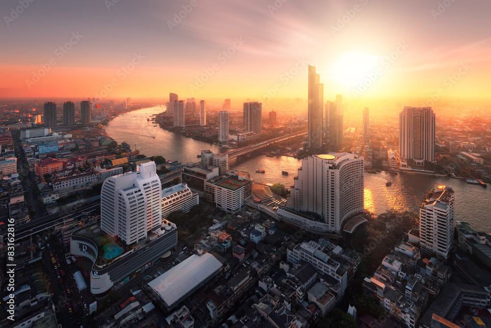 Bangkok city sunlight warm orange,sunrise in morning rooftop view, chao phraya river the office buildings in Bangkok city  skyline top view business office in capital city of Thailand Asian  - obrazy, fototapety, plakaty 